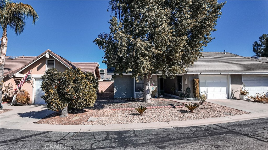 1419 Hancock Circle San Jacinto, CA 92583 - Photo 2 of 23 a view of a house with snow on the road