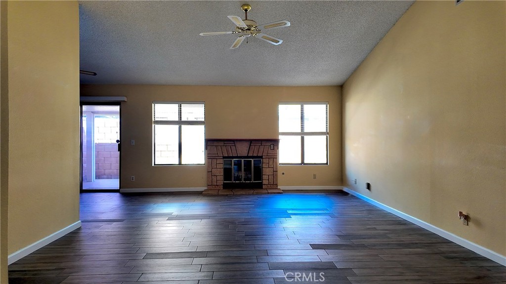 1419 Hancock Circle San Jacinto, CA 92583 - Photo 5 of 23 wooden floor in an empty room with a window