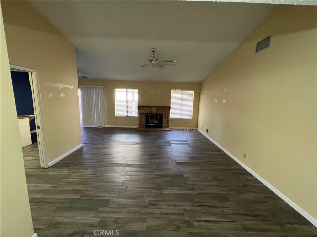 1419 Hancock Circle San Jacinto, CA 92583 - Photo 6 of 23 wooden floor in an empty room with a window