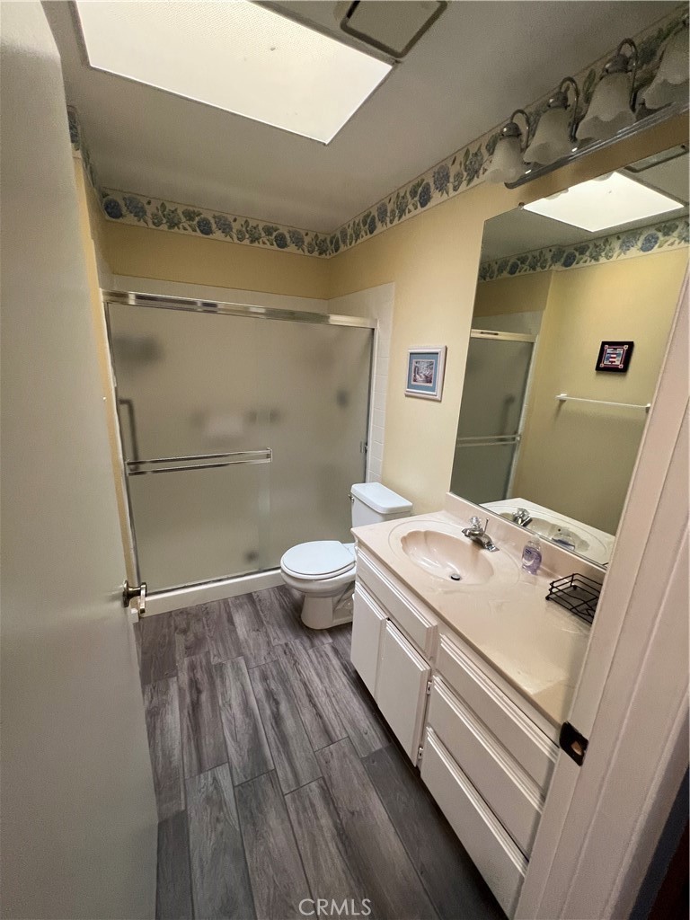 1419 Hancock Circle San Jacinto, CA 92583 - Photo 10 of 23 a bathroom with a sink a toilet and shower