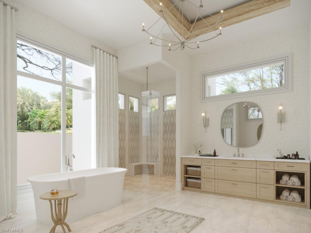 465 Gordonia Road Naples, FL 34108 - Photo 8 of 12 a bathroom with a double vanity sink mirror and bathtub