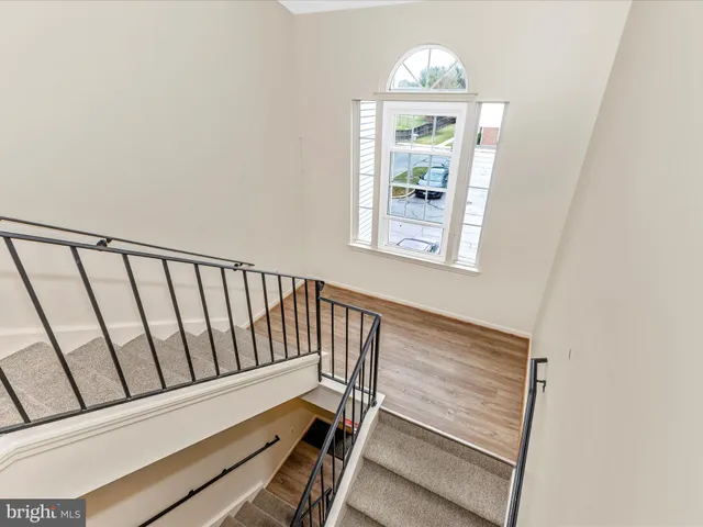 a view of staircase with window