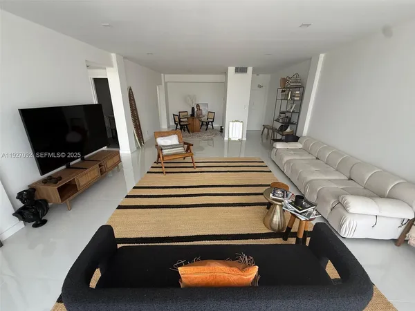 a room with gym equipment and a flat screen tv