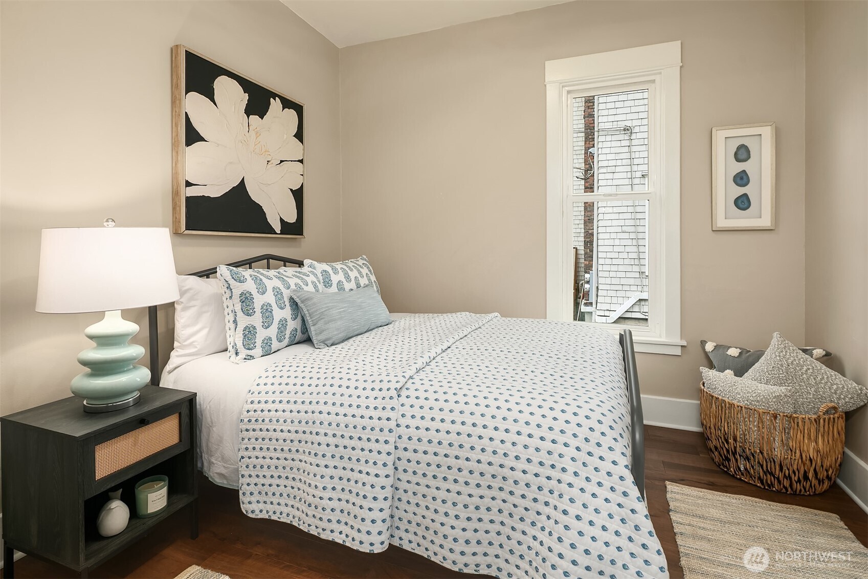 511 West McGraw Street Seattle, WA 98119 - Photo 11 of 21 a bedroom with a bed and wooden floor