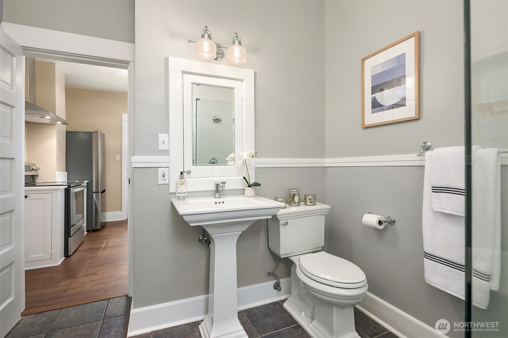 511 West McGraw Street Seattle, WA 98119 - Photo 13 of 21 a bathroom with a toilet sink and mirror