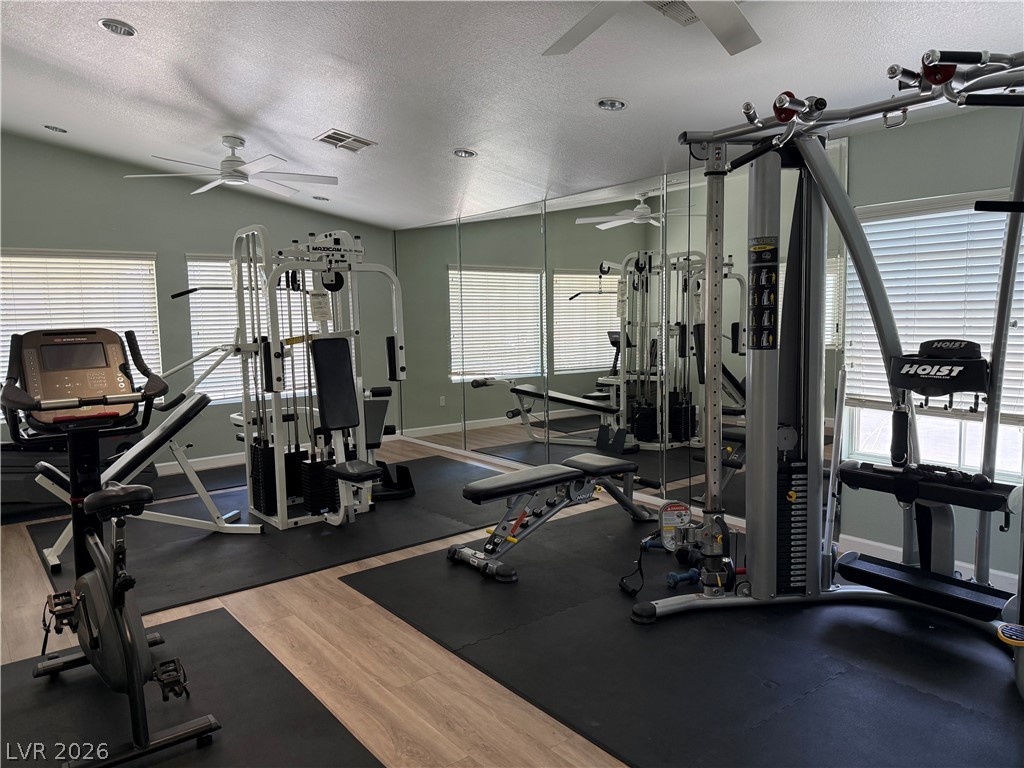 517 Crumpler Place Henderson, NV 89052 - Photo 7 of 9 Fitness room designed for a complete workout, featuring mirrored walls and modern equipment.