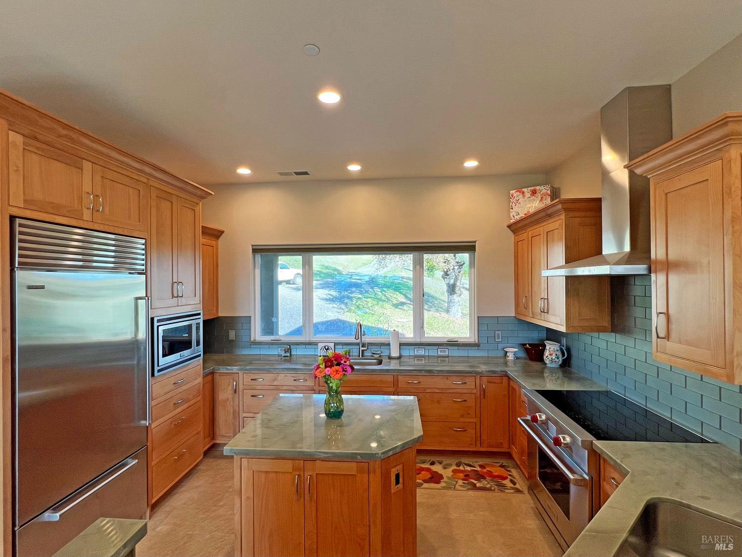 11401 Bakers Creek Road Redwood Valley, CA 95470 - Photo 14 of 70 a kitchen with granite countertop a sink a counter top space appliances and cabinets