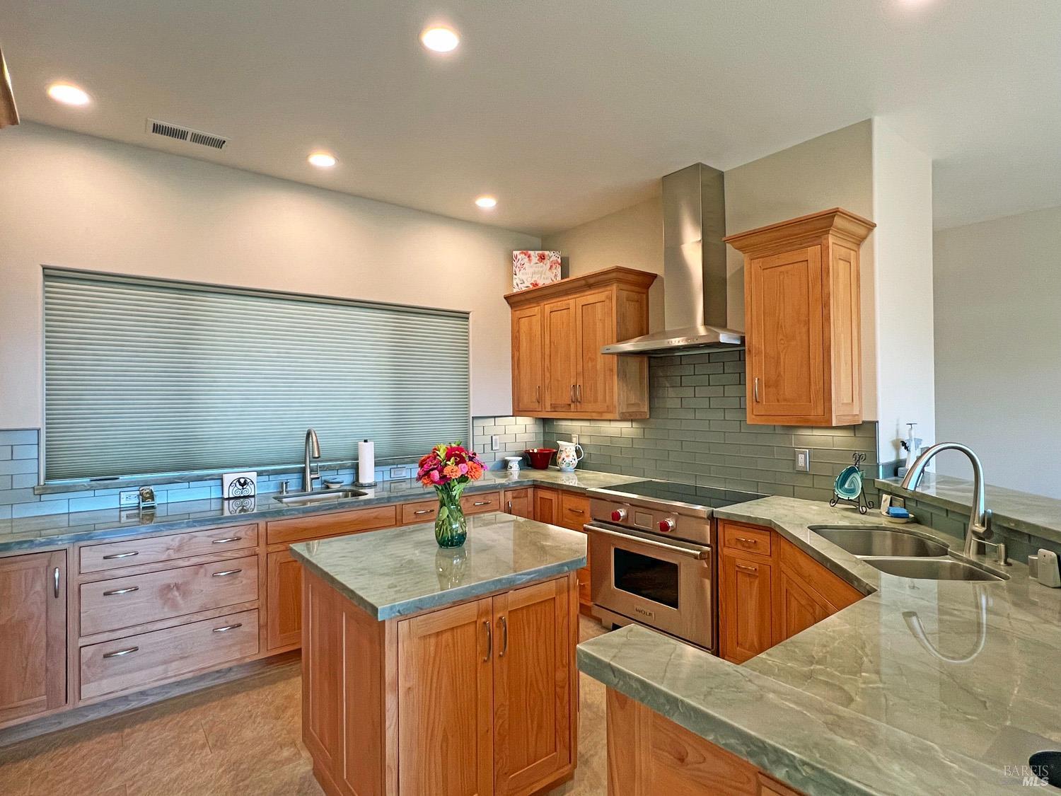 11401 Bakers Creek Road Redwood Valley, CA 95470 - Photo 16 of 70 a kitchen that has a sink a stove counter space and a sink in it