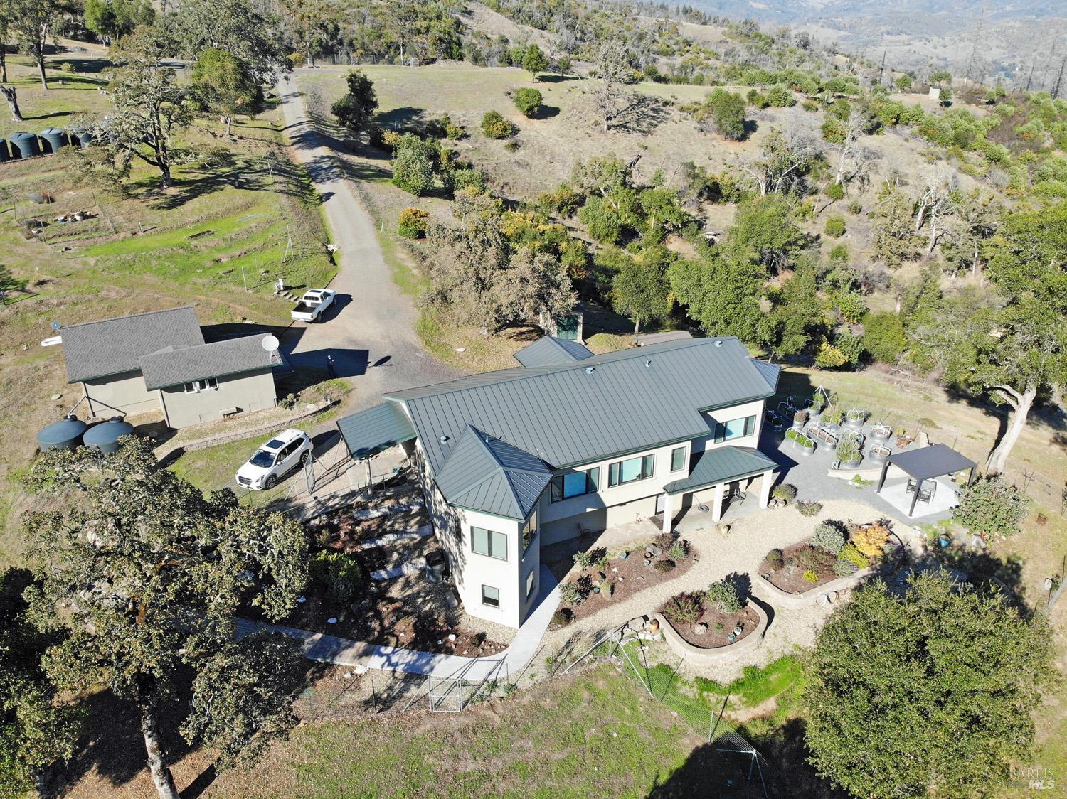 11401 Bakers Creek Road Redwood Valley, CA 95470 - Photo 2 of 70 an aerial view of a house with yard swimming pool and lake view