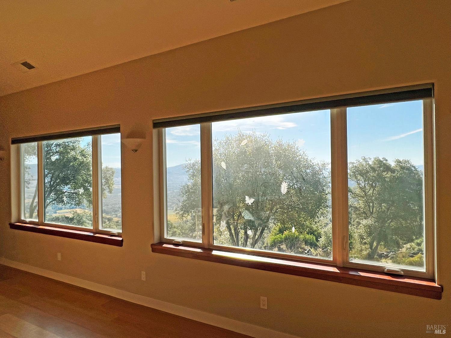 11401 Bakers Creek Road Redwood Valley, CA 95470 - Photo 23 of 70 wooden floor in an empty room with a large window