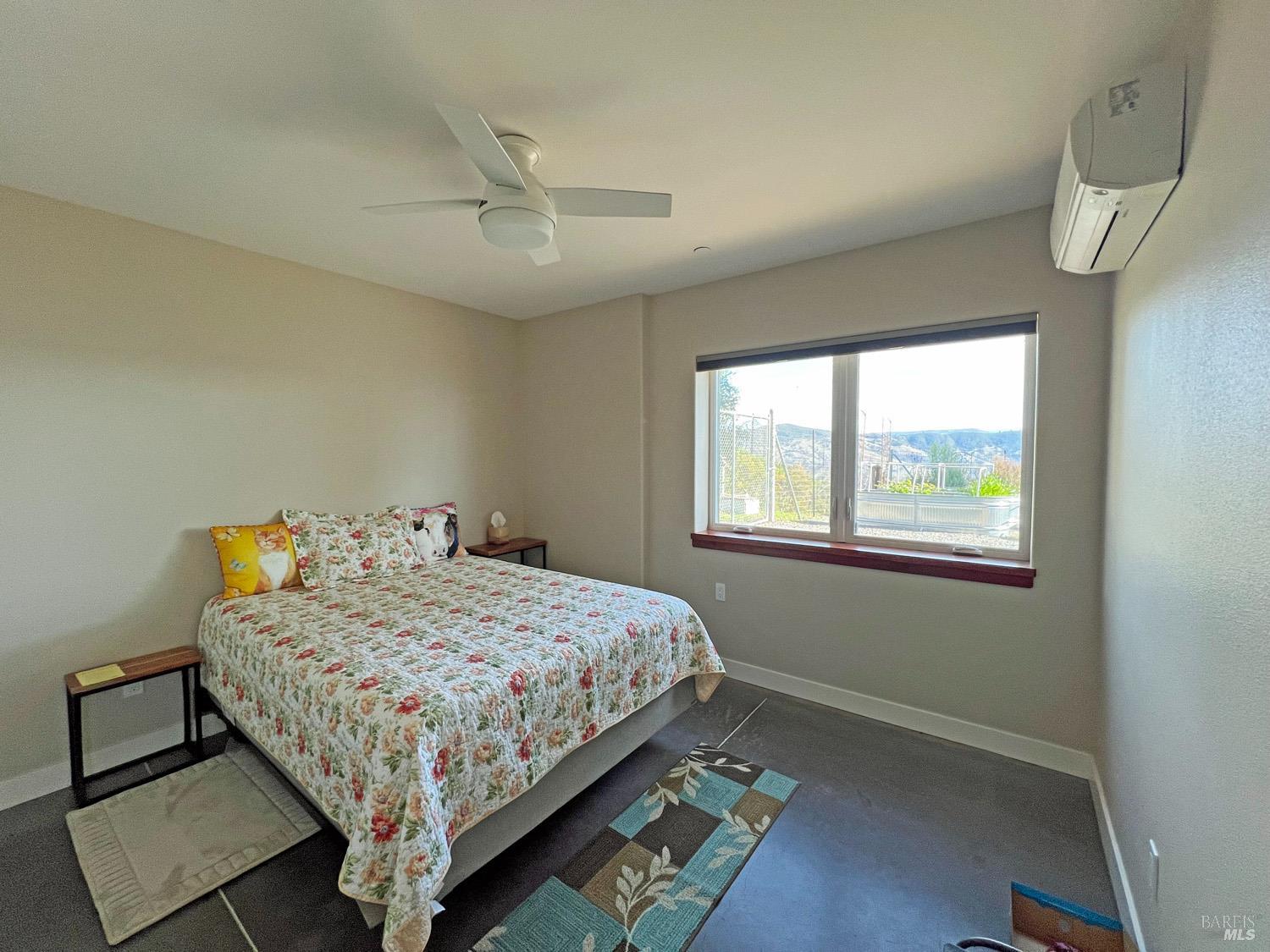11401 Bakers Creek Road Redwood Valley, CA 95470 - Photo 26 of 70 a bedroom with a bed and a window