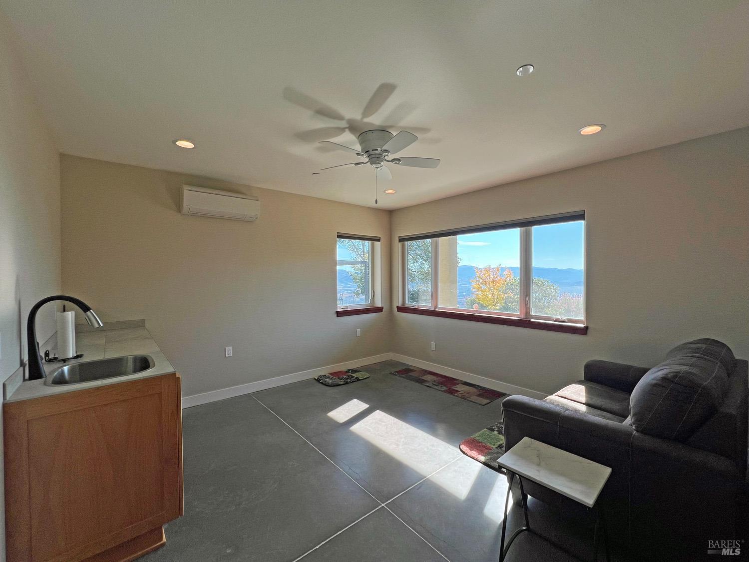 11401 Bakers Creek Road Redwood Valley, CA 95470 - Photo 28 of 70 a living room with furniture and a window