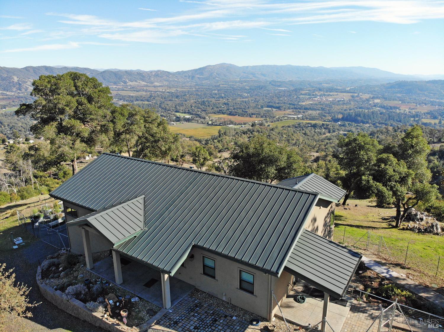 11401 Bakers Creek Road Redwood Valley, CA 95470 - Photo 3 of 70 a view of a chairs and table on the terrace