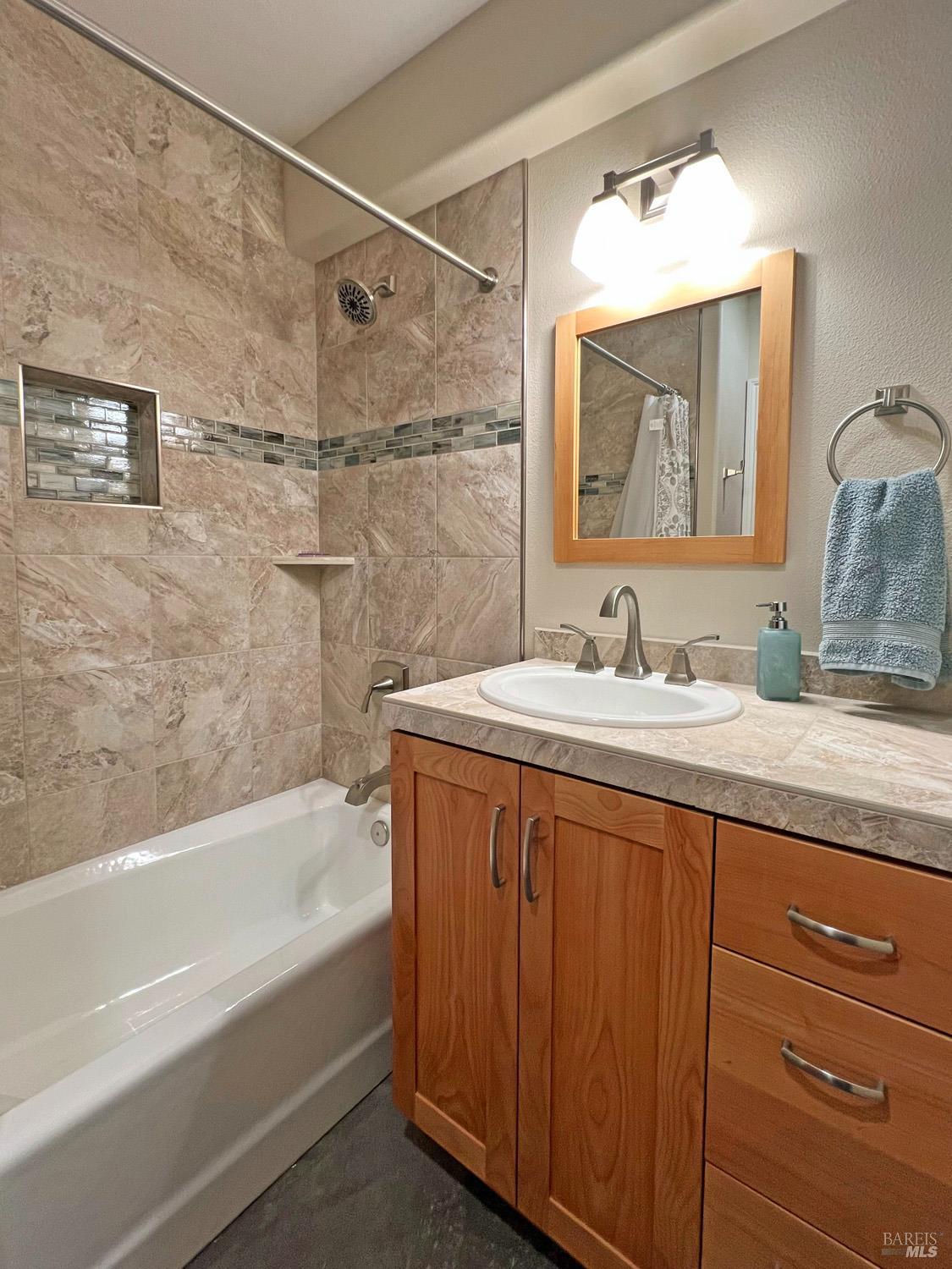 11401 Bakers Creek Road Redwood Valley, CA 95470 - Photo 34 of 70 a bathroom with a granite countertop sink mirror double vanity and bathtub