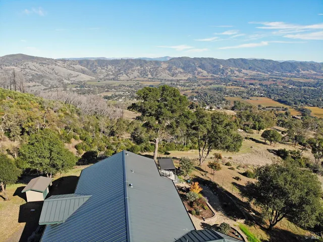 an aerial view of residential house with outdoor space