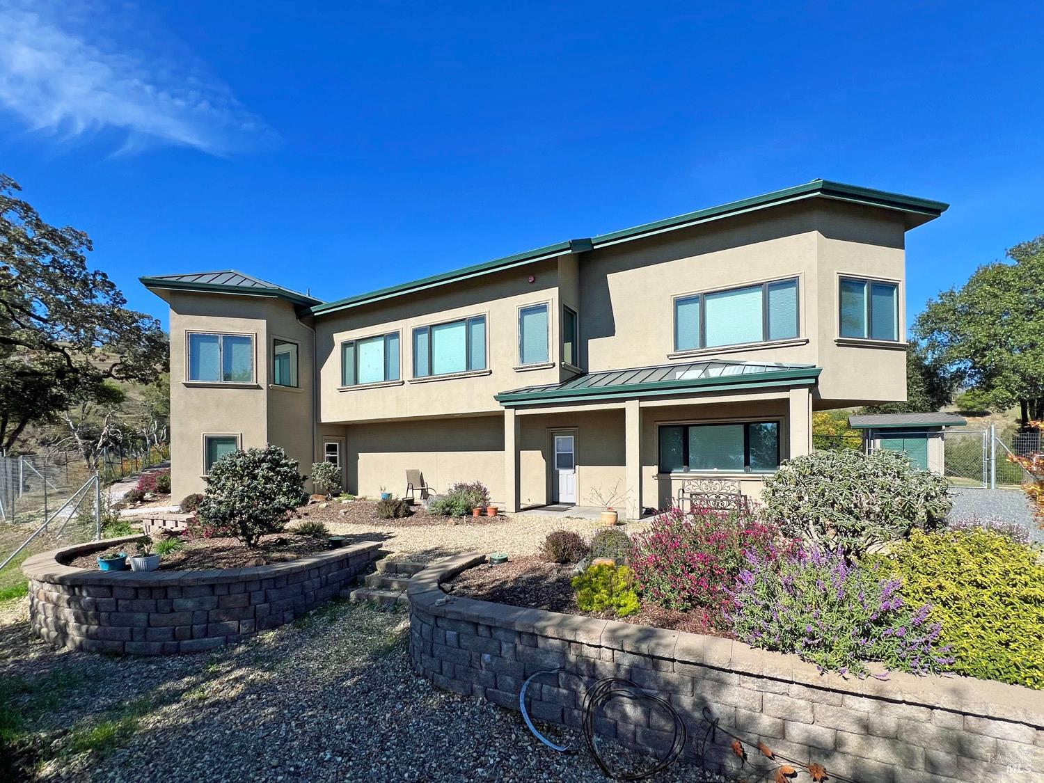 11401 Bakers Creek Road Redwood Valley, CA 95470 - Photo 6 of 70 a front view of a house with a yard