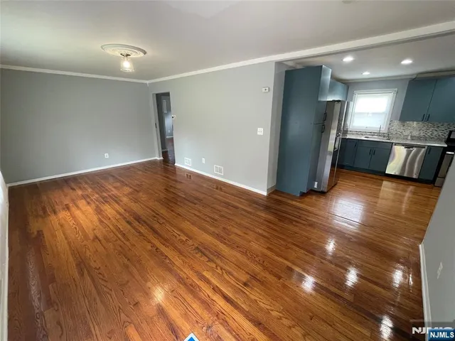 a view of a livingroom with wooden floor
