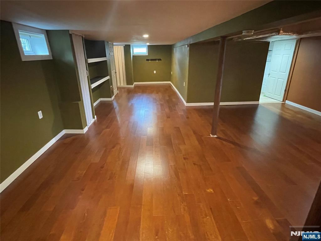 12 Fordham Road Oakland, NJ 07436 - Photo 16 of 26 wooden floor in an empty room with a window