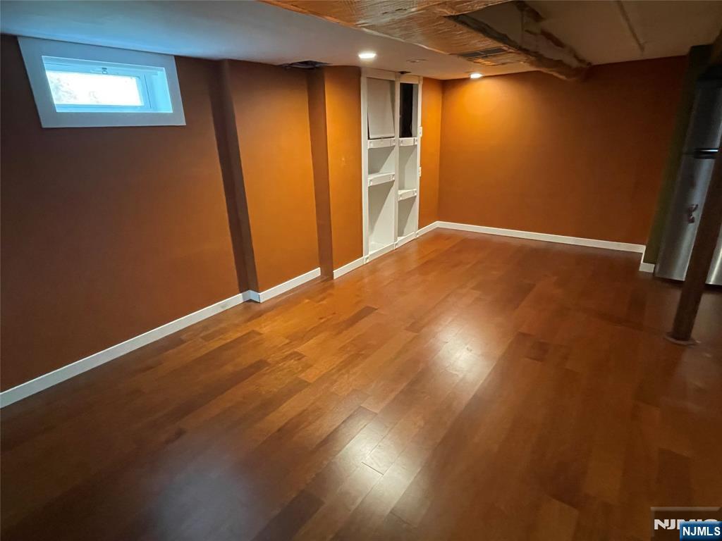 12 Fordham Road Oakland, NJ 07436 - Photo 18 of 26 a view of empty room with wooden floor