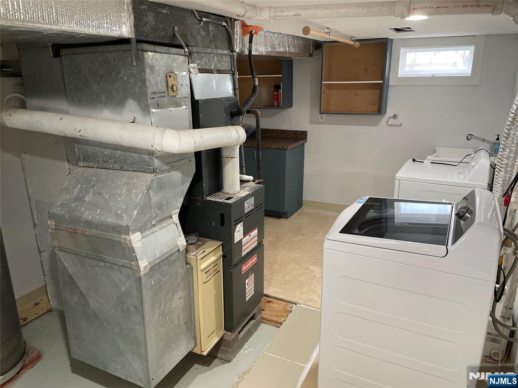 12 Fordham Road Oakland, NJ 07436 - Photo 21 of 26 a close view of a sink and a stove in a room