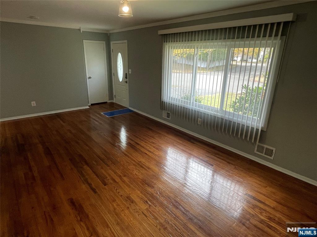 12 Fordham Road Oakland, NJ 07436 - Photo 9 of 26 a view of an empty room with wooden floor and a window