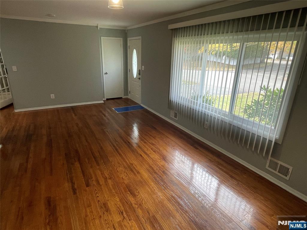 12 Fordham Road Oakland, NJ 07436 - Photo 10 of 26 a view of an empty room and wooden floor