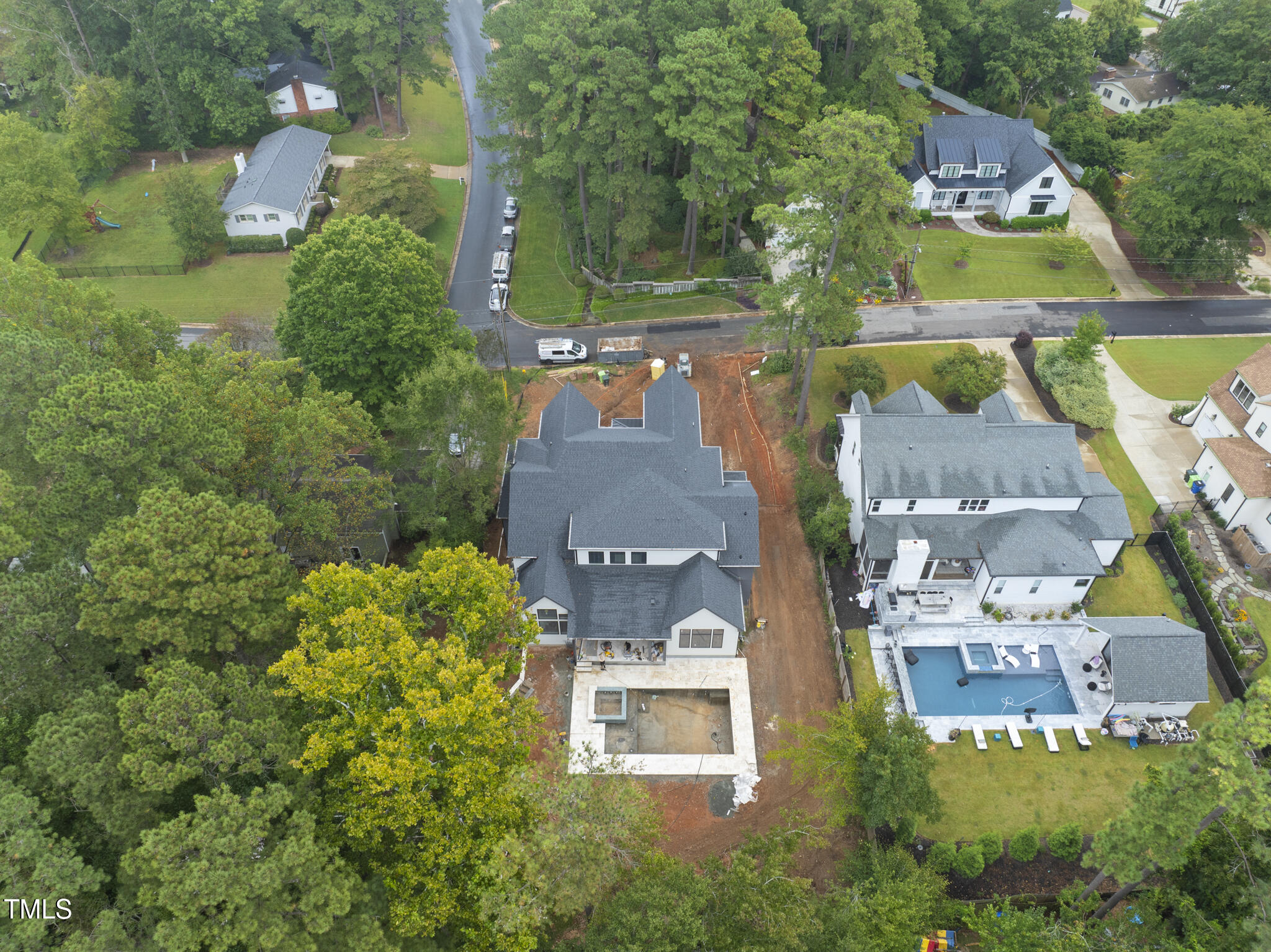 5013 Coronado Drive Raleigh, NC 27609 - Photo 45 of 76 an aerial view of residential house with outdoor space and swimming pool