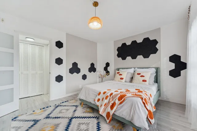 a bedroom with a bed and a window