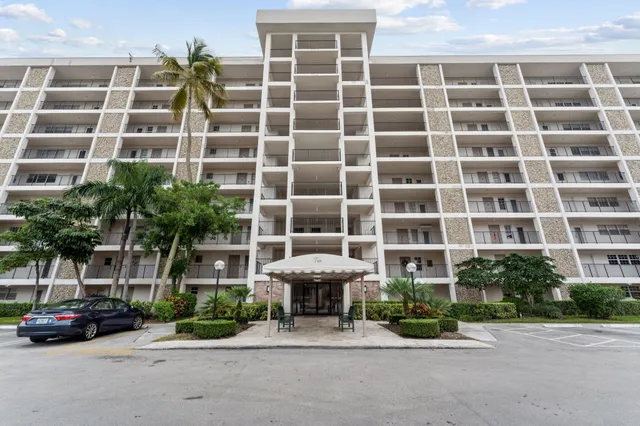 a front view of a building with garden