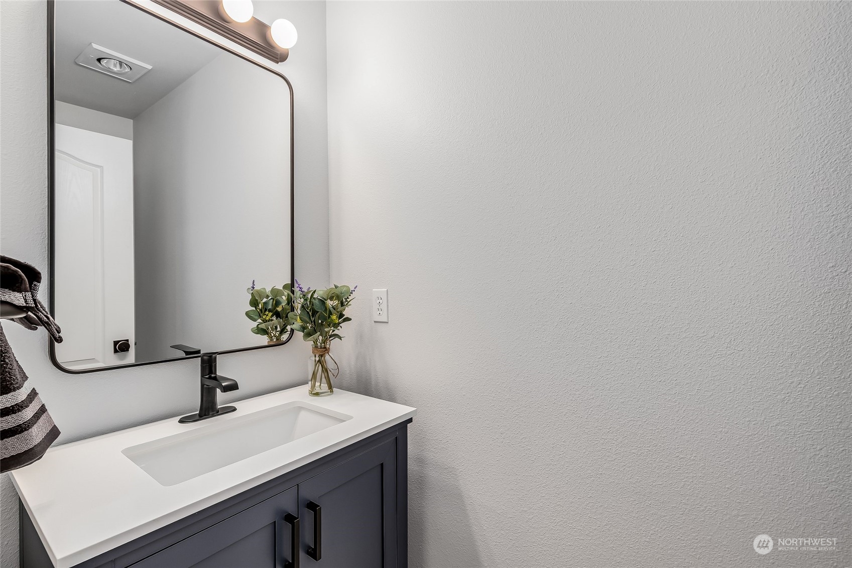 10030 Holly Drive, Unit 122 Everett, WA 98204 - Photo 14 of 29 a bathroom with a sink and a mirror