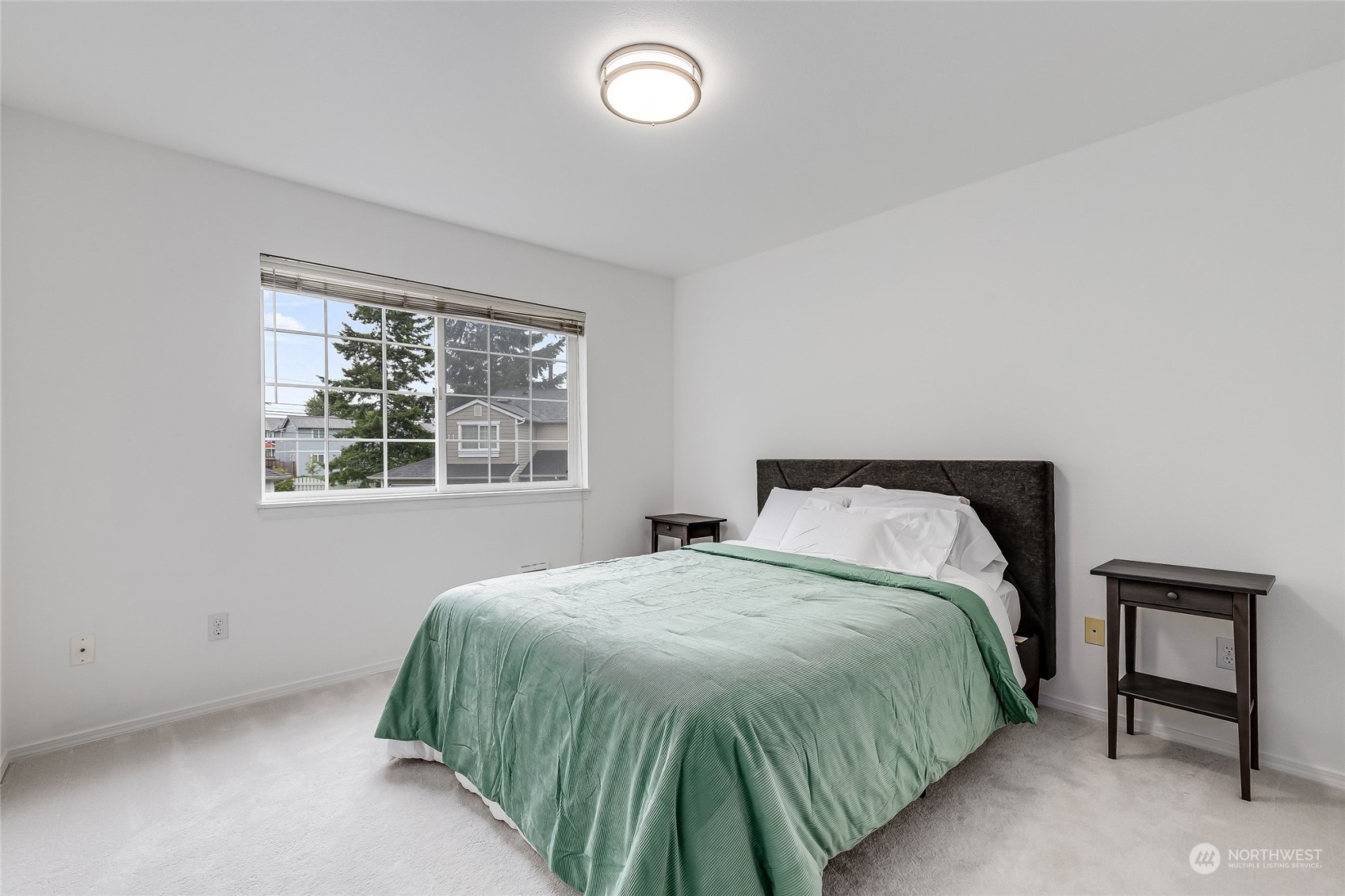 10030 Holly Drive, Unit 122 Everett, WA 98204 - Photo 16 of 29 a bedroom with a bed and window