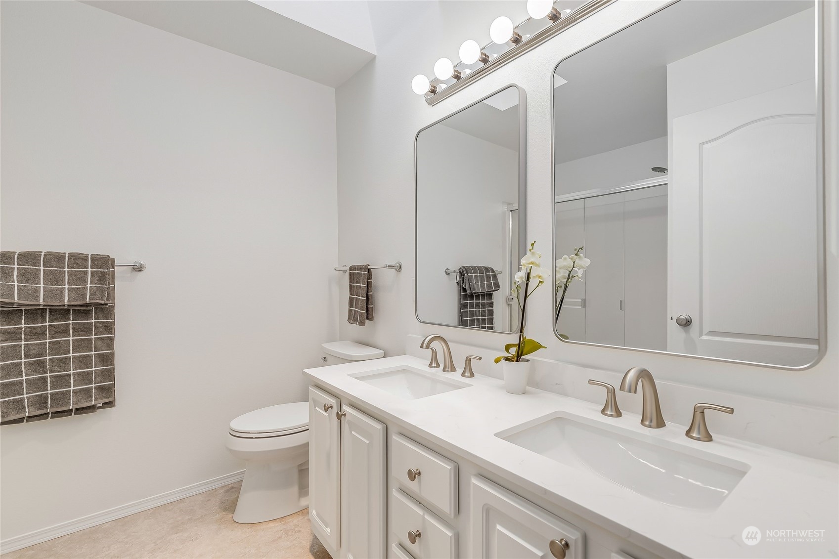 10030 Holly Drive, Unit 122 Everett, WA 98204 - Photo 20 of 29 a bathroom with a sink vanity granite toilet and a mirror