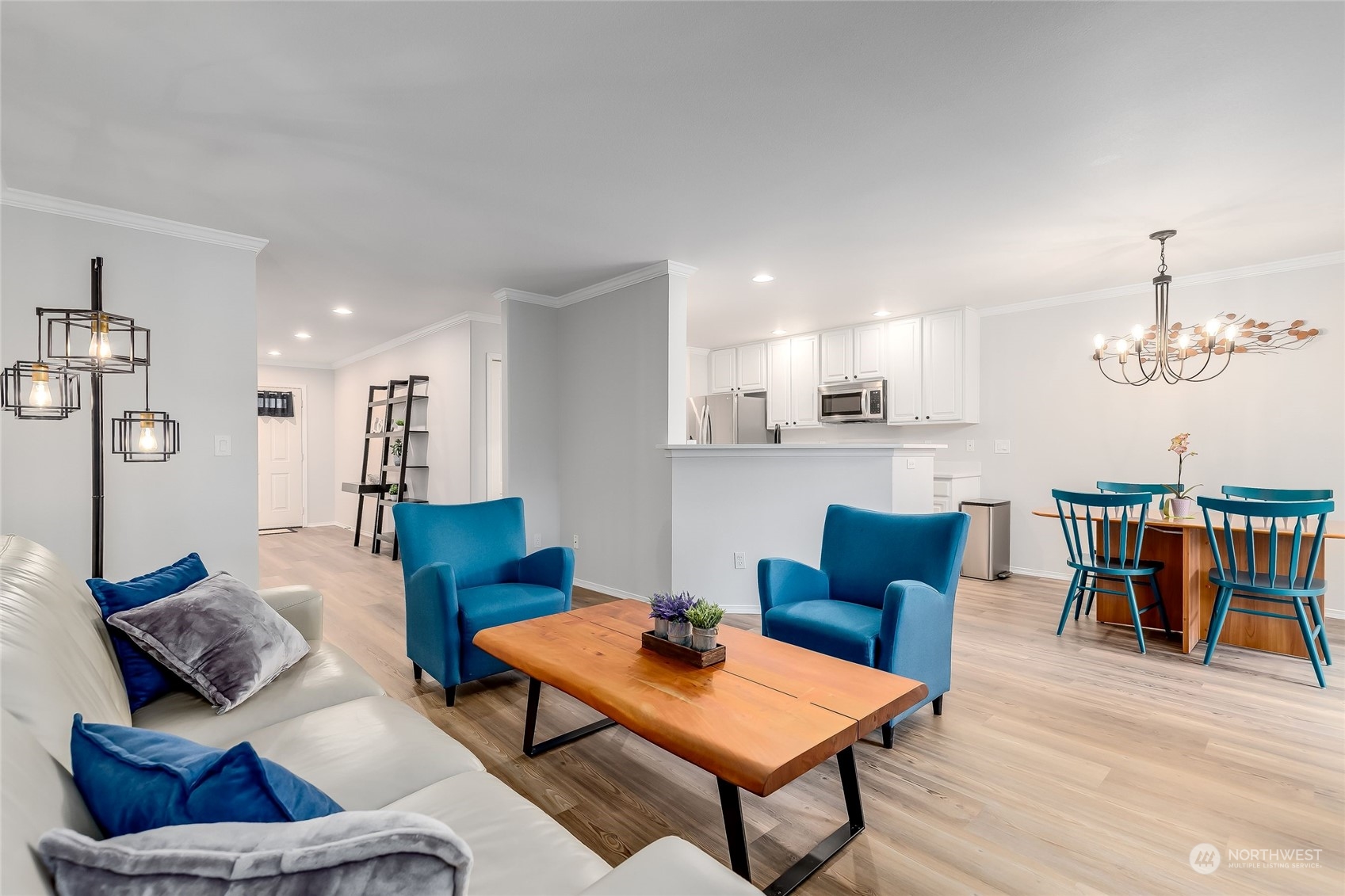 10030 Holly Drive, Unit 122 Everett, WA 98204 - Photo 2 of 29 a living room with furniture and kitchen view