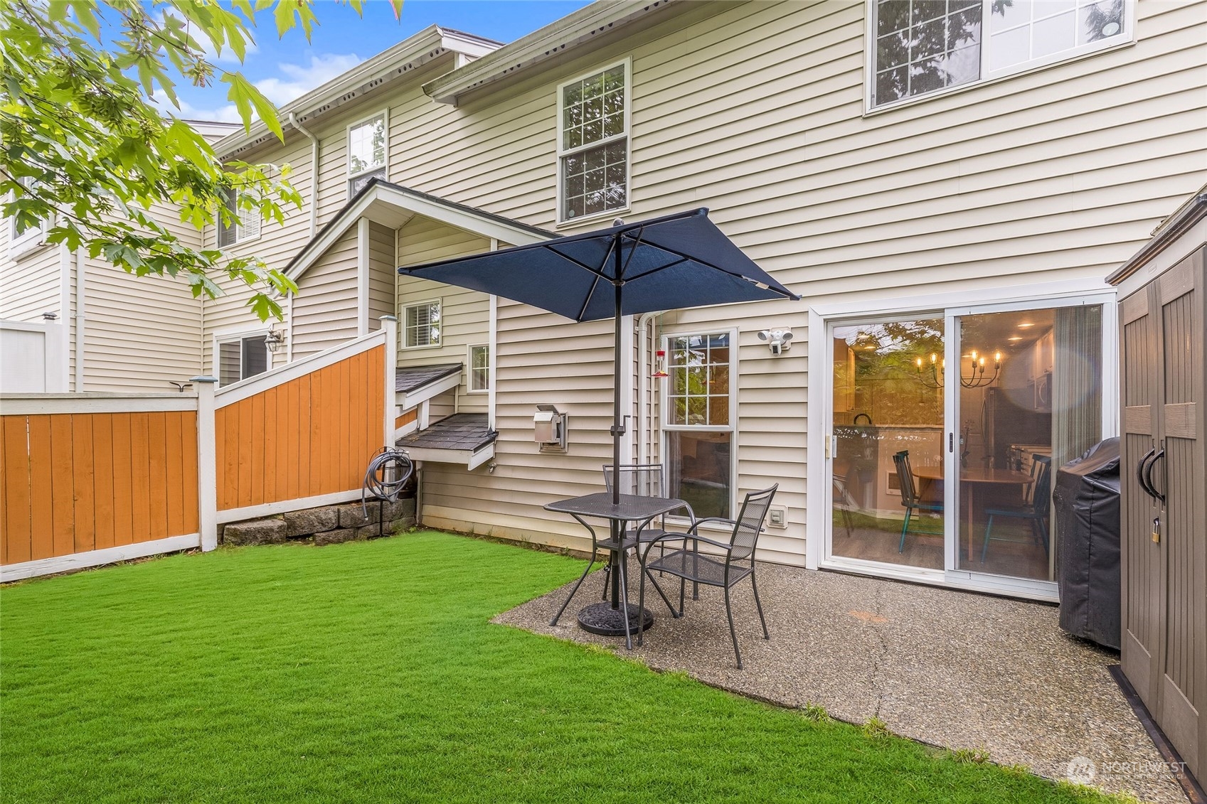 10030 Holly Drive, Unit 122 Everett, WA 98204 - Photo 27 of 29 a view of a chair and table in backyard of the house
