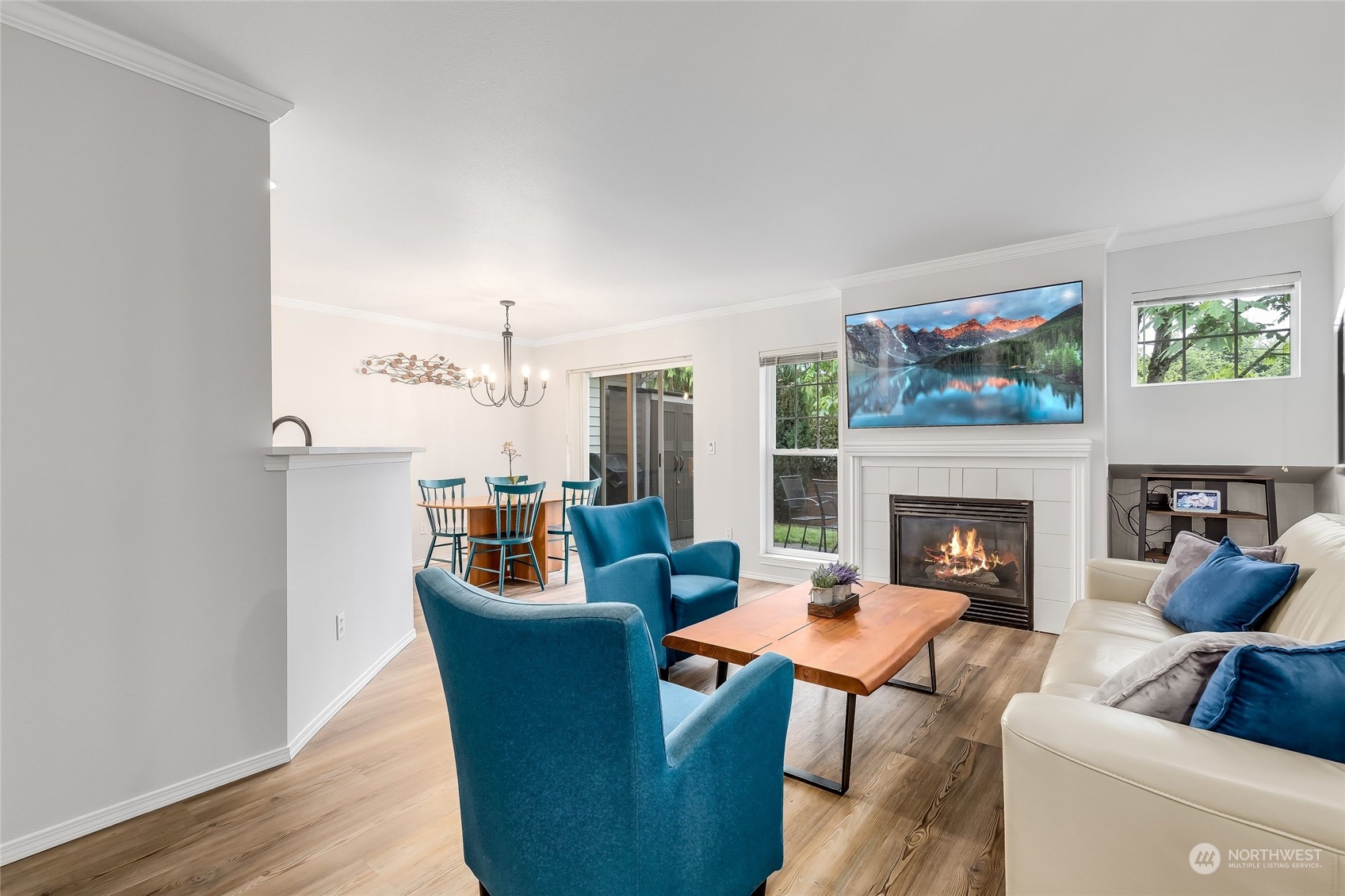 10030 Holly Drive, Unit 122 Everett, WA 98204 - Photo 4 of 29 a living room with furniture a fireplace and a painting