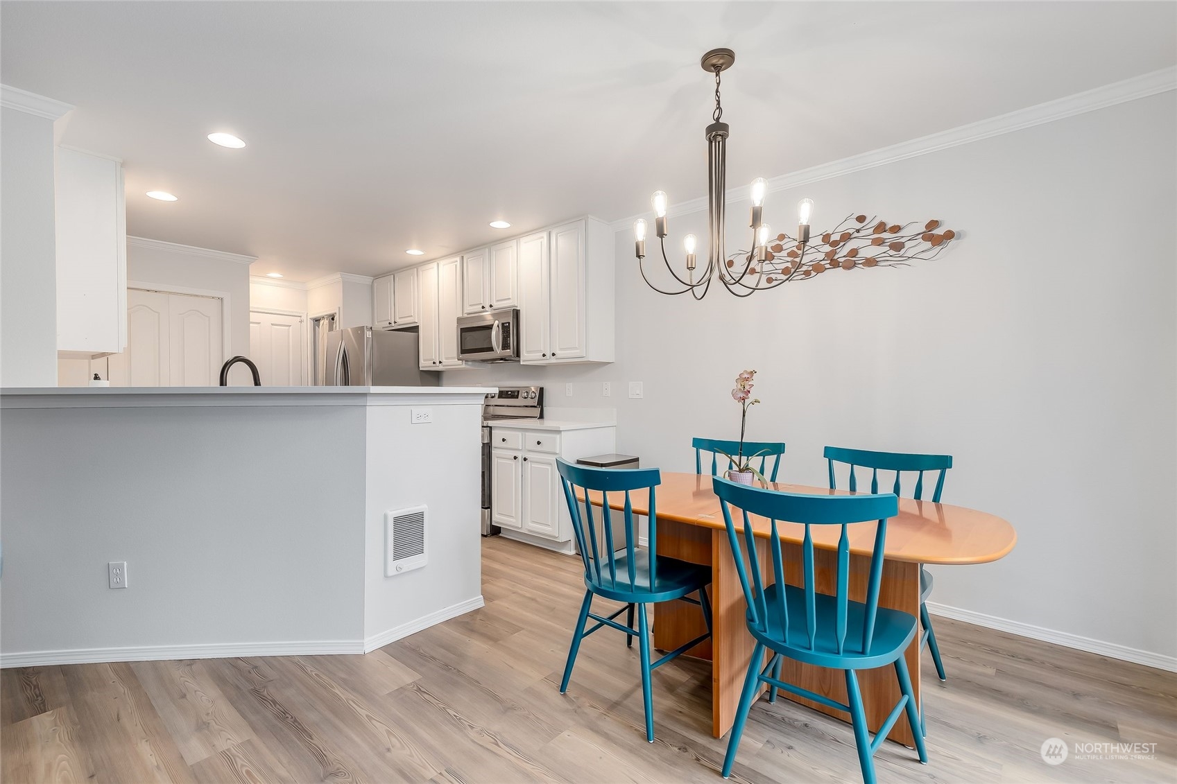 10030 Holly Drive, Unit 122 Everett, WA 98204 - Photo 7 of 29 a view of a dining room with furniture and chandelier