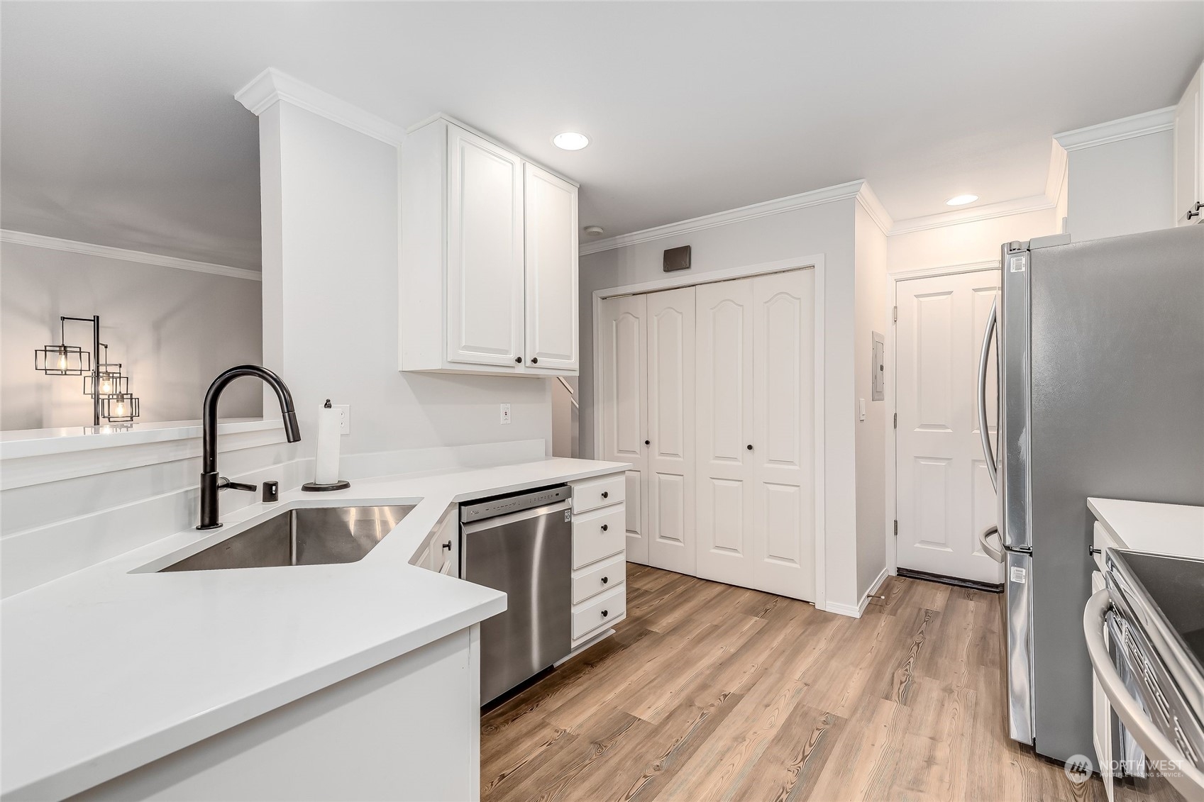 10030 Holly Drive, Unit 122 Everett, WA 98204 - Photo 10 of 29 a kitchen with stainless steel appliances a refrigerator sink and cabinets