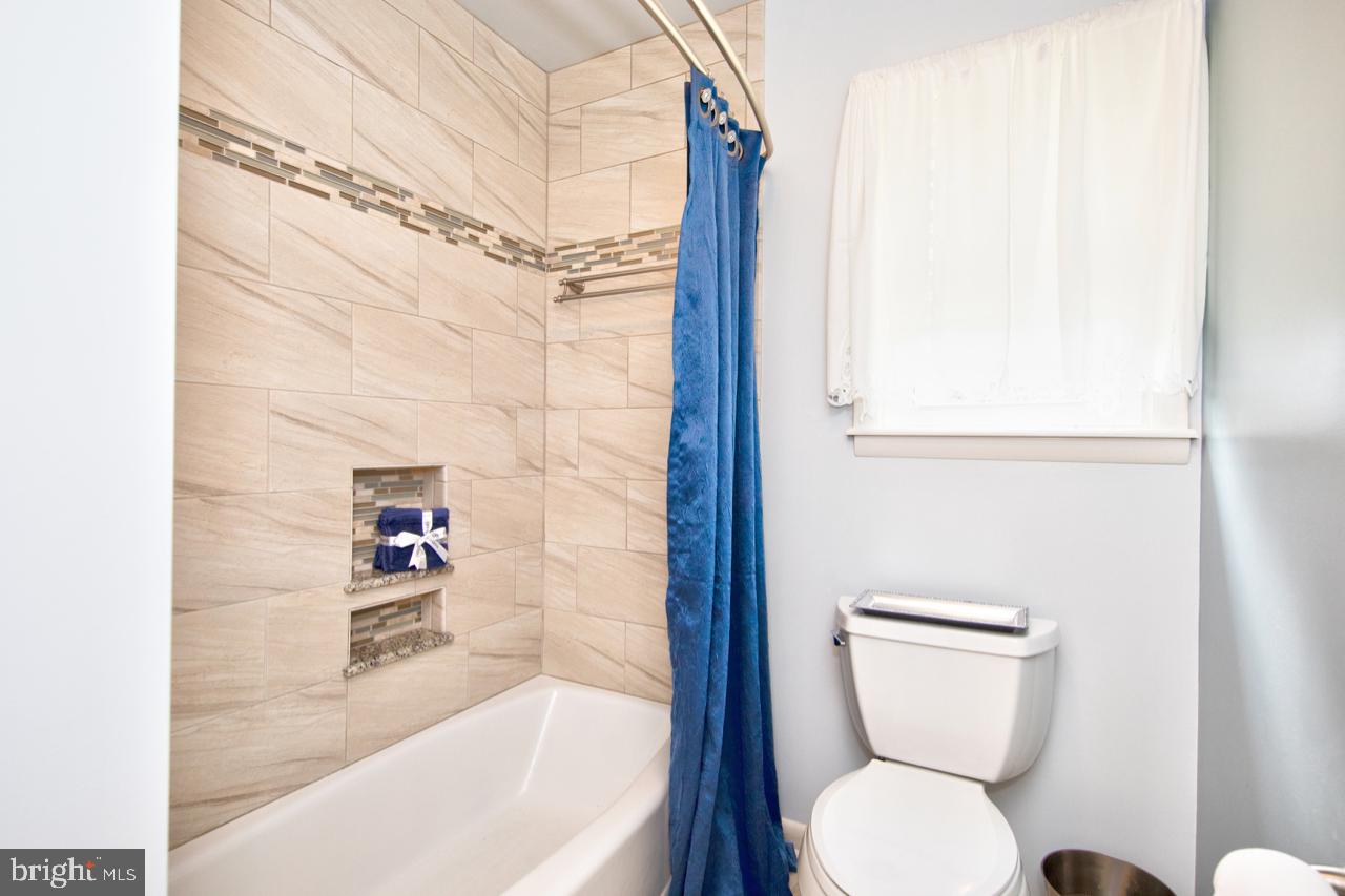 8701 Inwood Road Baltimore, MD 21244 - Photo 21 of 34 Custom tile work W/ new toilet & flooring