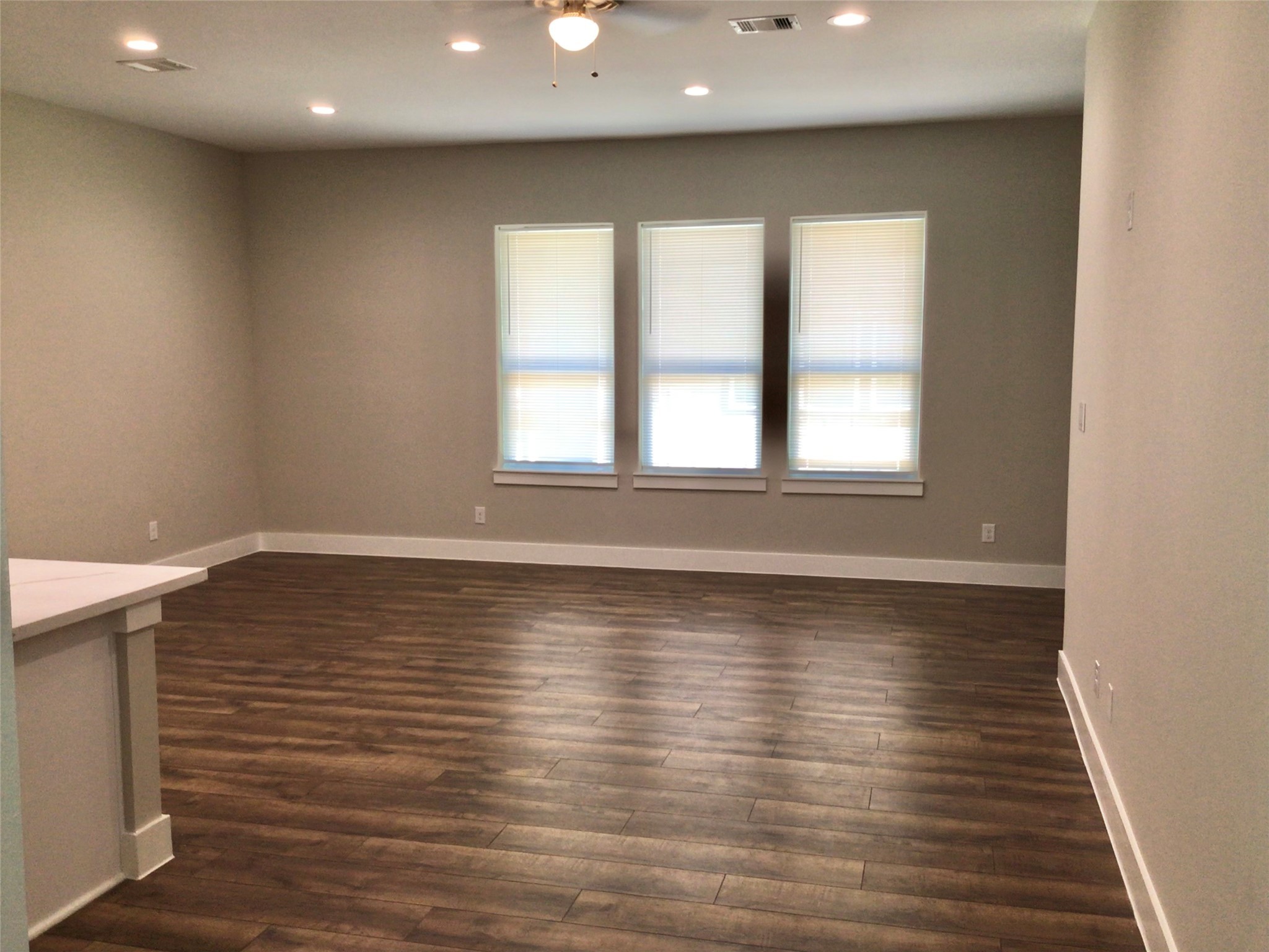2109 Marnel Road, Unit C Houston, TX 77055 - Photo 7 of 27 an empty room with wooden floor and windows