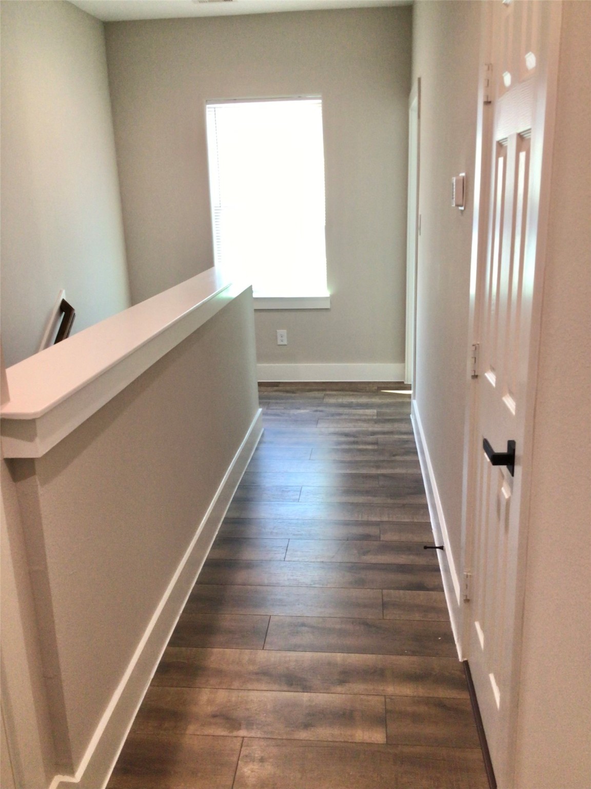 2109 Marnel Road, Unit C Houston, TX 77055 - Photo 9 of 27 a view of a hallway with wooden floor