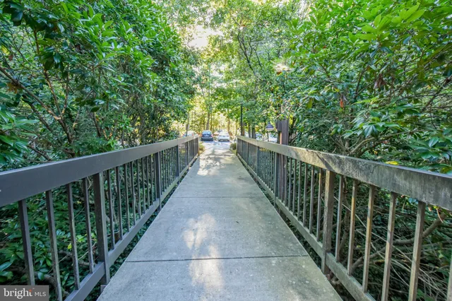 a view of a balcony with wooden floor