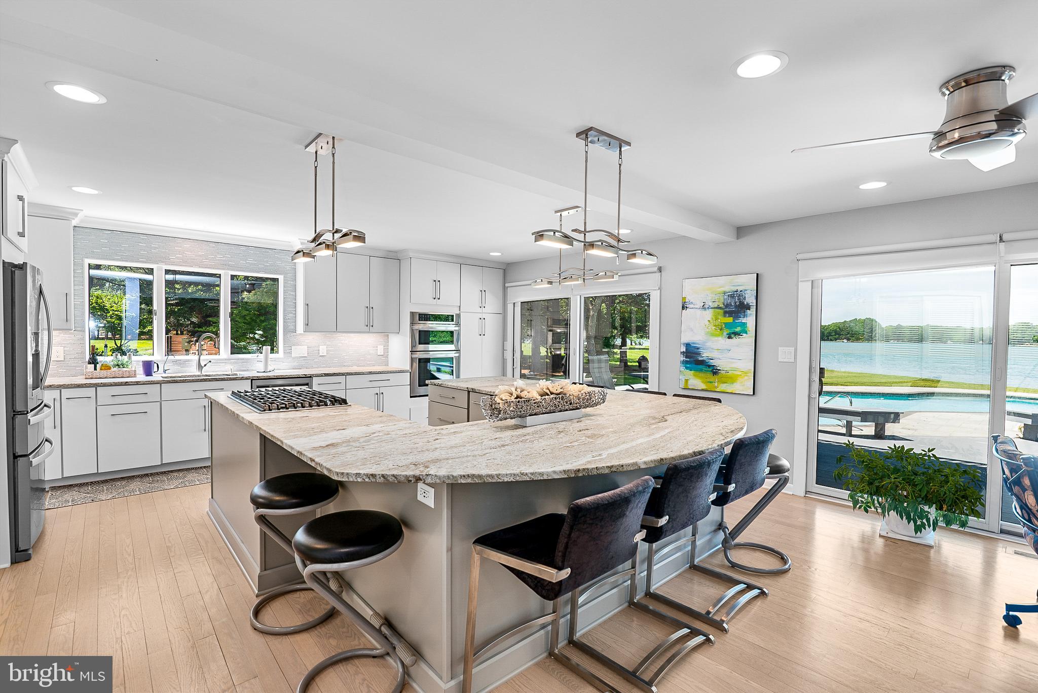 26282 Deep Water Harbor Road Easton, MD 21601 - Photo 15 of 53 a large kitchen with a table and chairs