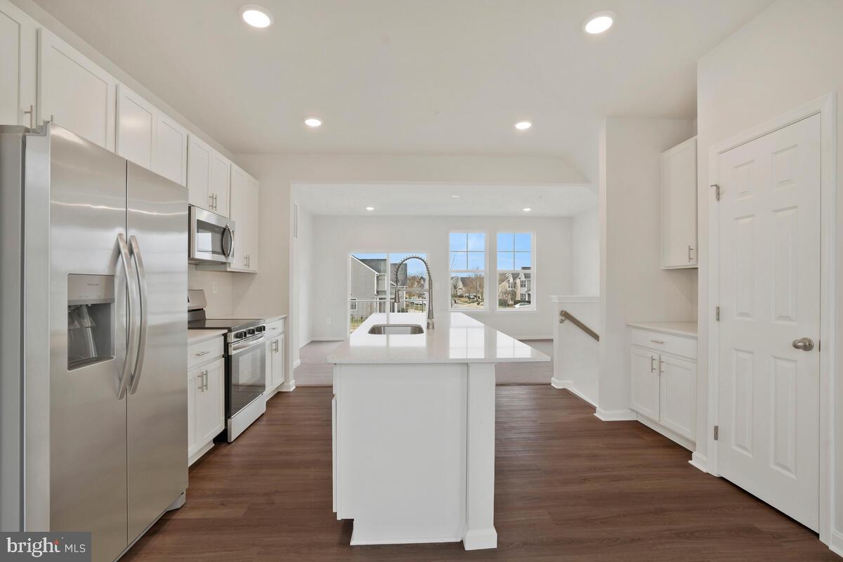 284 Topher's Trail Prince Frederick, MD 20678 - Photo 11 of 16 Bright and airy modern kitchen space.