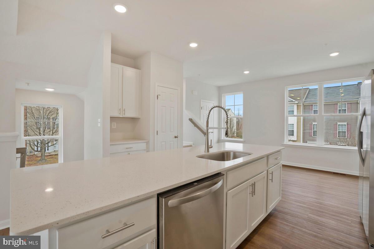 284 Topher's Trail Prince Frederick, MD 20678 - Photo 14 of 16 Bright and airy modern kitchen space.