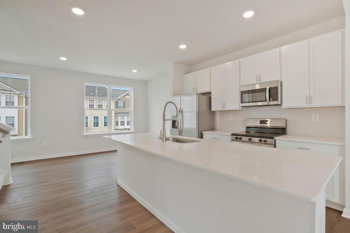 284 Topher's Trail Prince Frederick, MD 20678 - Photo 7 of 16 Bright and airy modern kitchen space.