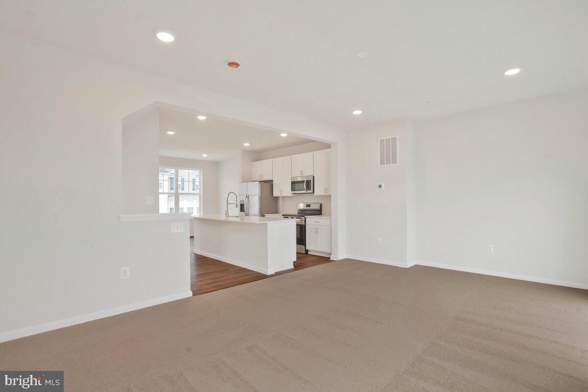 284 Topher's Trail Prince Frederick, MD 20678 - Photo 10 of 16 Bright and airy open-concept living.