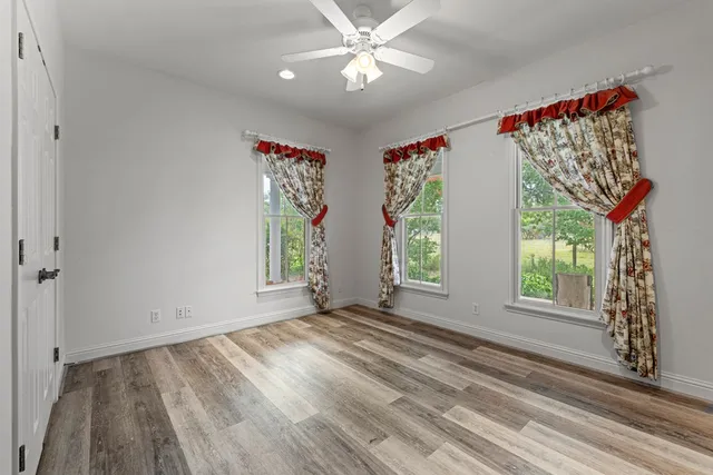 a view of livingroom with window and hardwood floor