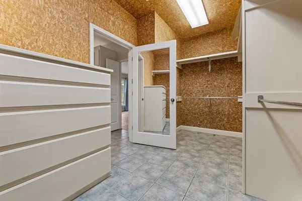 a view of an empty walk in closet