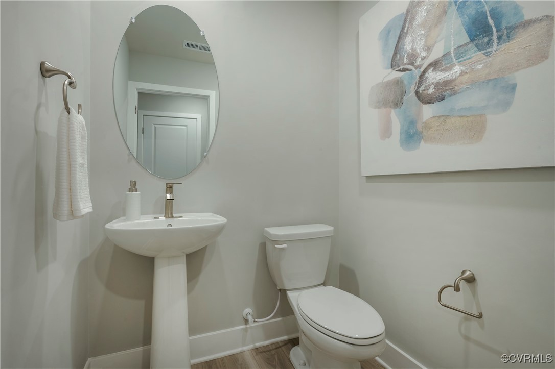 16017 Abelson Way Chesterfield, VA 23832 - Photo 15 of 21 a bathroom with a toilet sink and mirror