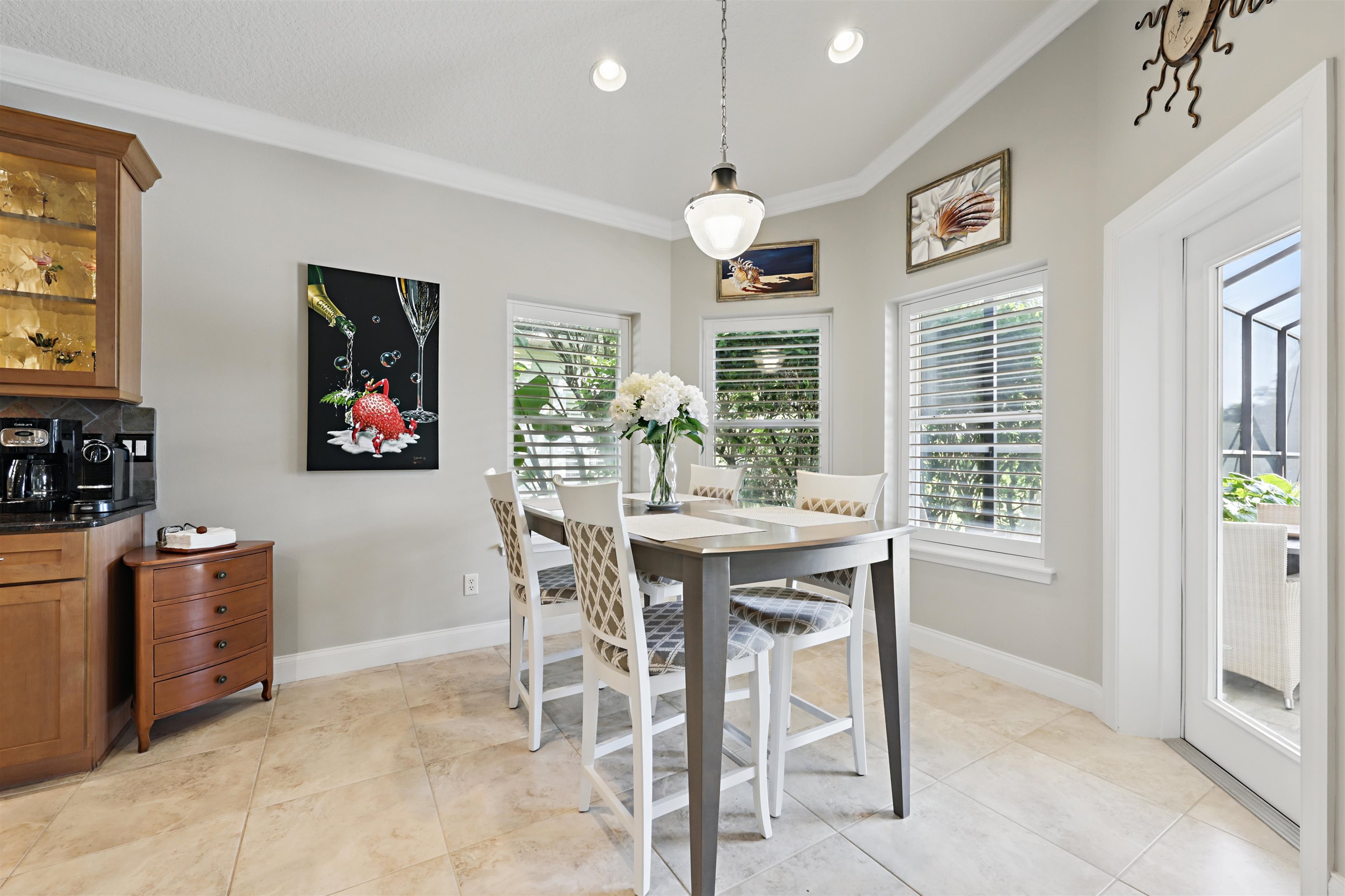 322 Fiddlers Point Drive St. Augustine, FL 32080 - Photo 12 of 58 a view of a dining room with furniture and chandelier